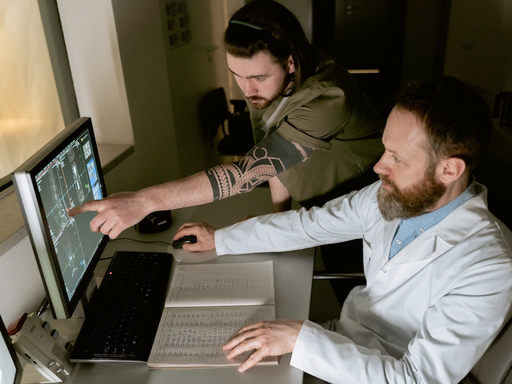 Scientists working on a computer